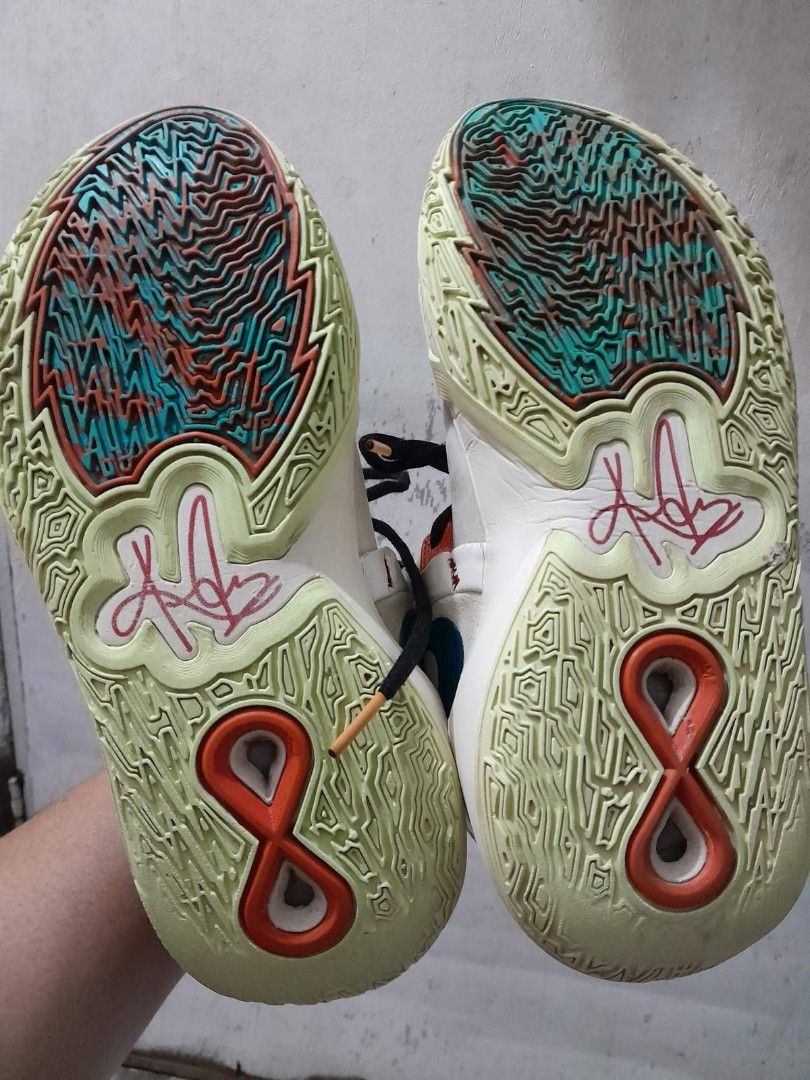 Nike Kyrie infinity Chinese New year (Category: Sneakers) located in Calamba. Submitted by ysabellascloset17 (Listing ID 1402479867, Image 2). Description: Nike Kyrie 8 EP sneakers. Features a white, blue, and orange color scheme. The size is US 7, EUR 40, and CM 25. The shoes have a unique design on the soles and the Nike logo is visible on the side. The shoes have black laces and a patterned design on the tongue..
