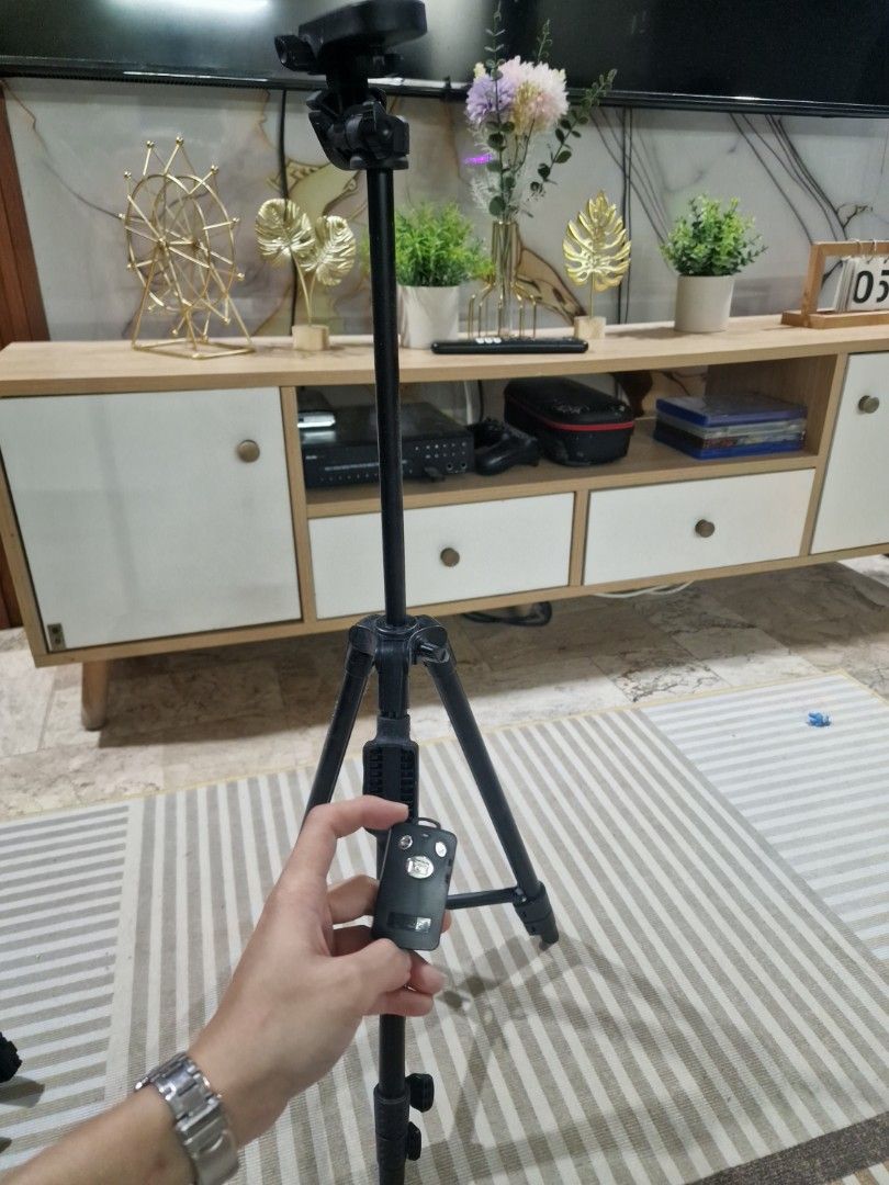 Phone & DSLR camera tripod with shutter control (Category: Tripods & Monopods) located in Manila. Submitted by ali_suson (Listing ID 1402612983, Image 1). Description: up to 5ft height .