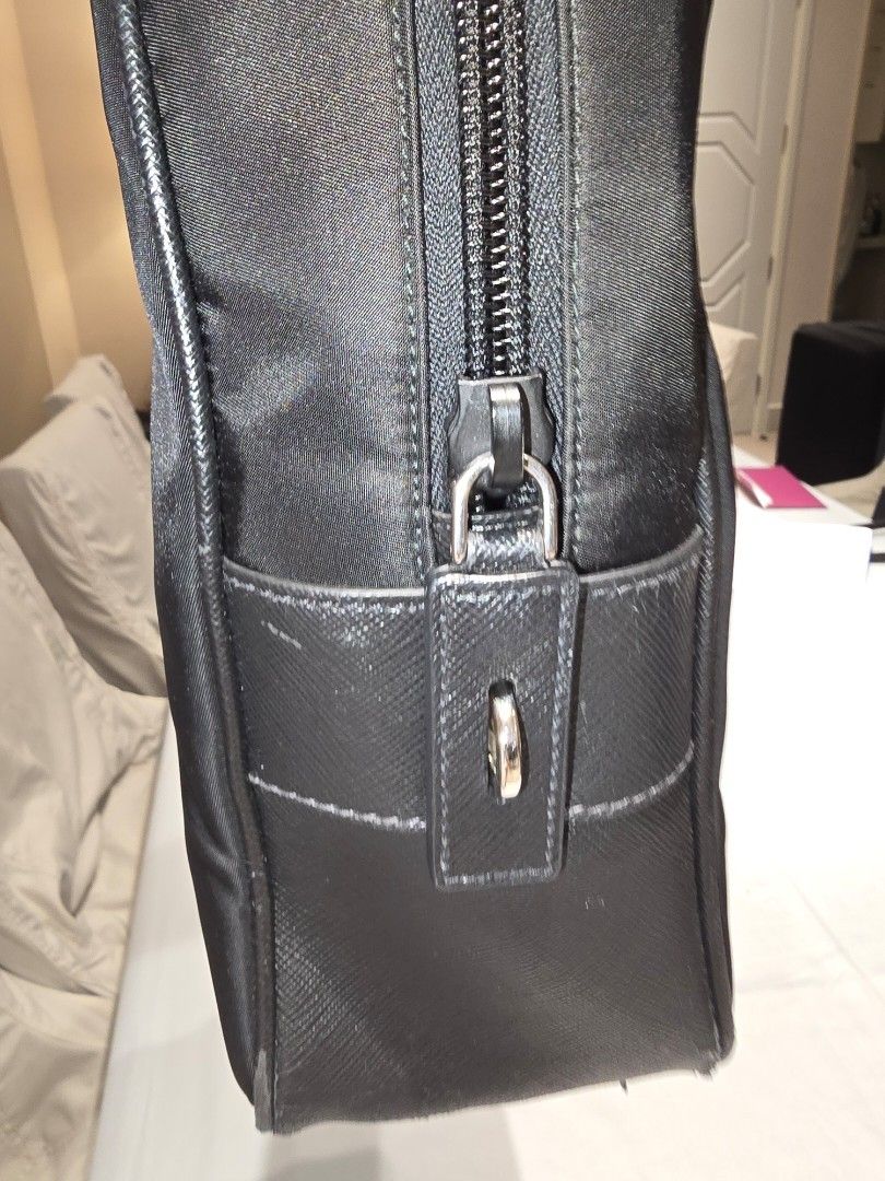 Prada Nylon Bag (Category: Luxury Bags & Wallets) located in Taguig. Submitted by coreboxe (Listing ID 1386608544, Image 3). Description: Prada Bag Nylon and Leather combination complete with cards and the pad lock. there are minimal issues like chipping of Leather on handle and base. you may check the unit here in Rockwell Joel's Place. Used for less than 5 months. super clean. Buy the bag and get the strap free. meet up at Rockwell, Joel's plac