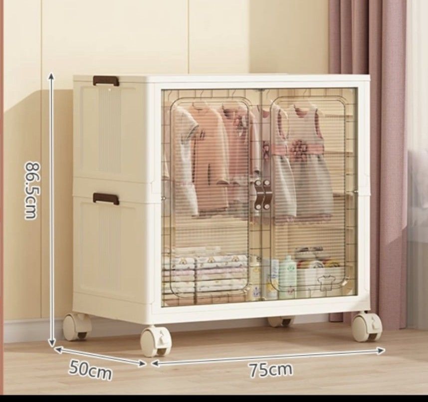 Stackable Wardrobe with Wheels (Category: Shelves, Cabinets & Racks) located in Singapore. Submitted by kurty (Listing ID 1402611321, Image 1). Description: - Rolling wardrobe for easy movement. - Two clear doors for visibility. - stalkable - Ideal for bedrooms or any space needing organization. - got 2 unit, 1 for $50.