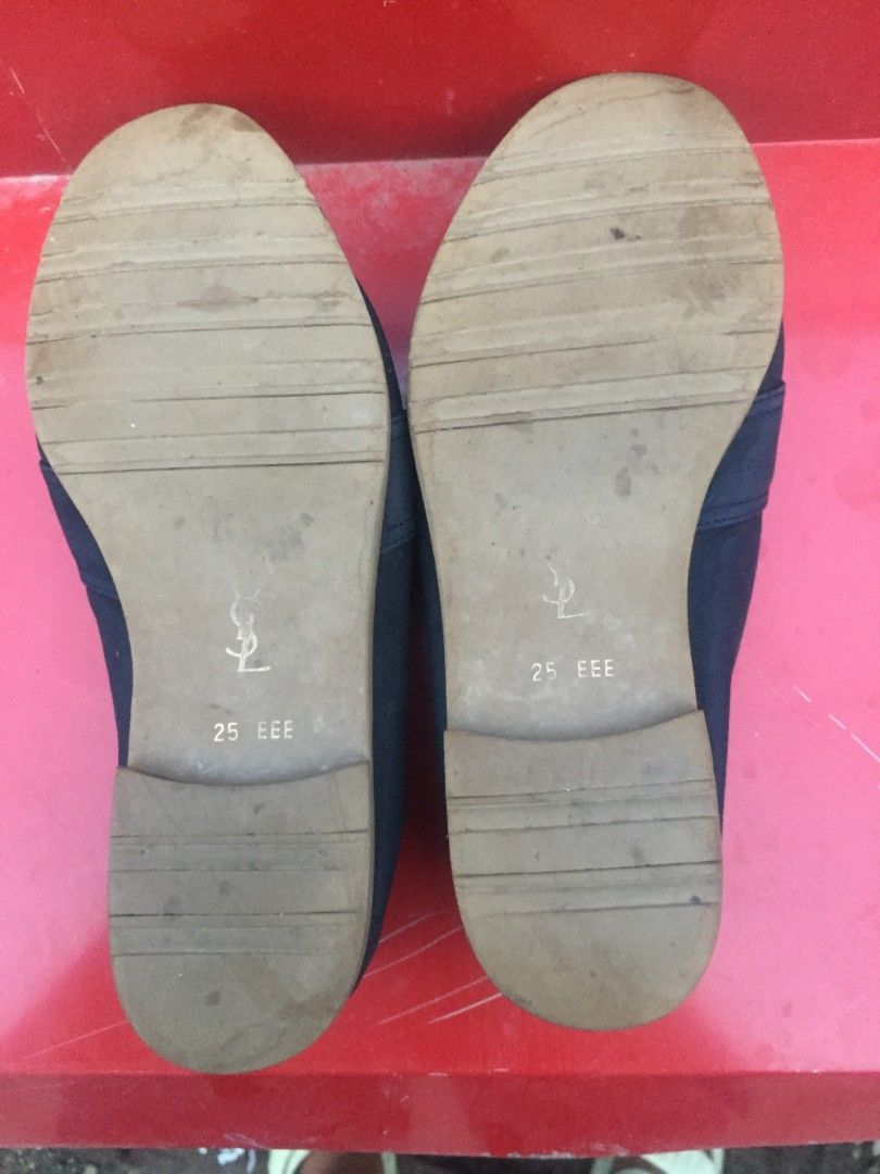 Yves Saint Laurent Black Loafers (Category: Loafers) located in Cabuyao City. Submitted by markrodbal45397 (Listing ID 1402547511, Image 3). Description: - Black Yves Saint Laurent loafers - Size: 25 EEE - Features a classic tassel design - Gold 'Yves Saint Laurent Paris' logo on insole - YSL logo on sole - Style code: YS1092 - Shows some wear on the soles.