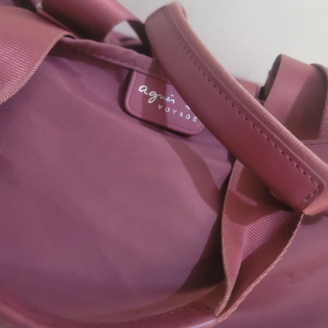 Agnes B. Voyage Shoulder Weekender Bag (Category: Luxury Bags & Wallets) located in Pasig City. Submitted by bunny.bella (Listing ID 1402703332, Image 3). Description: - Agnes B. Voyage shoulder bag - Lovely mauve color - Top handle and detachable shoulder strap - Zipper closure - Spacious interior with a small pocket - Silver hardware - Minor tear on the side Retails more than 10k up Still almost new but a little tear kn the side.