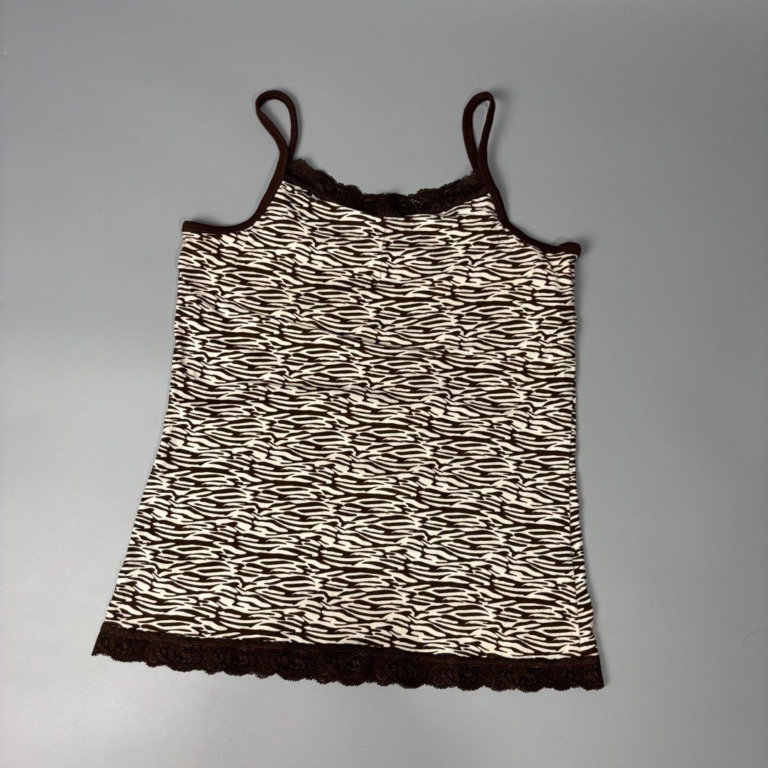 Arizona Zebra Print Cami Top (Category: Sleeveless) located in Angeles City. Submitted by tey68 (Listing ID 1402800551, Image 1). Description: Arizona camisole features a unique zebra print. It has brown straps and trim, with lace detailing along the neckline and hem. The tag indicates it is a Favorite Cami, made in Vietnam. It is a size L/G, equivalent to 14/16..