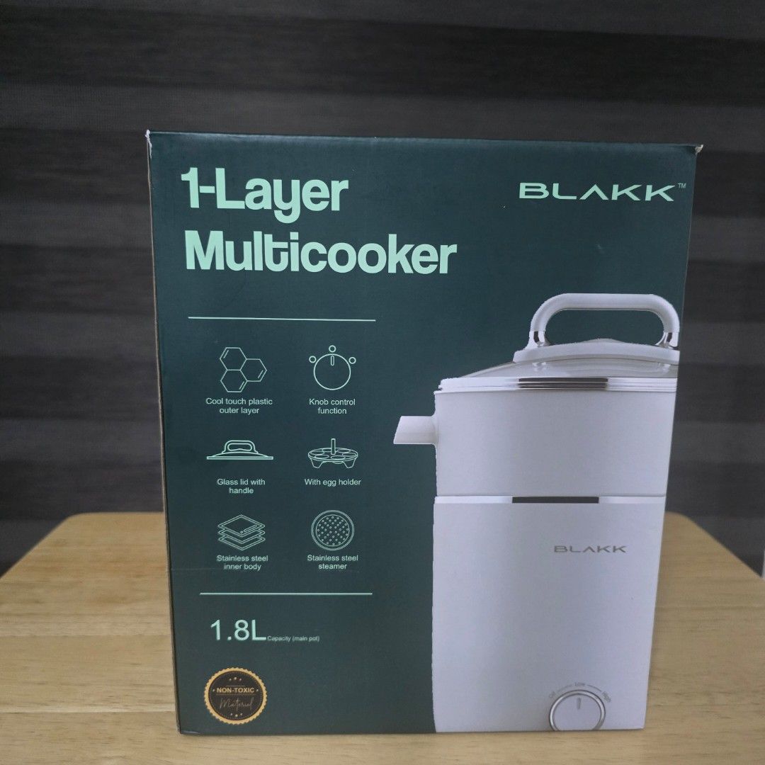Blakk 1-Layer Multicooker 1.8L (Category: Cookware & Accessories) located in Bacoor. Submitted by haru.tidyup (Listing ID 1402799967, Image 2). Description: Blakk 1-Layer Multicooker has a 1.8L capacity. It features a stainless steel inner body, cool-touch plastic outer layer, and a glass lid with a handle. It also includes a stainless steel steamer and an egg holder. The multicooker has a knob control function. ---- 💵 Payment Method: GCash/BPI/