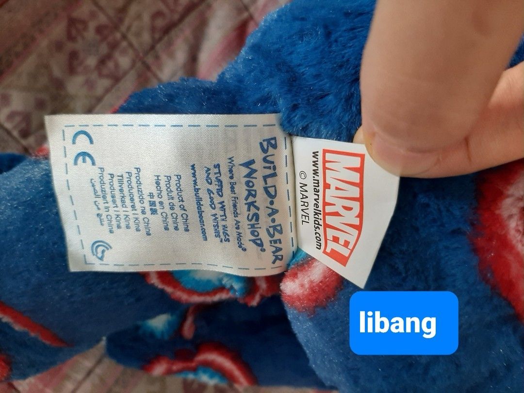 Build-A-Bear Marvel avengers Captain America Bear (Category: Plushies & Soft Toys) located in Paranaque City. Submitted by jiggsly (Listing ID 1402666430, Image 2). Description: - Build-A-Bear Captain America plush - Features a blue body with Captain America shield patterns - White muzzle and black nose - Official Marvel product - Soft and cuddly.