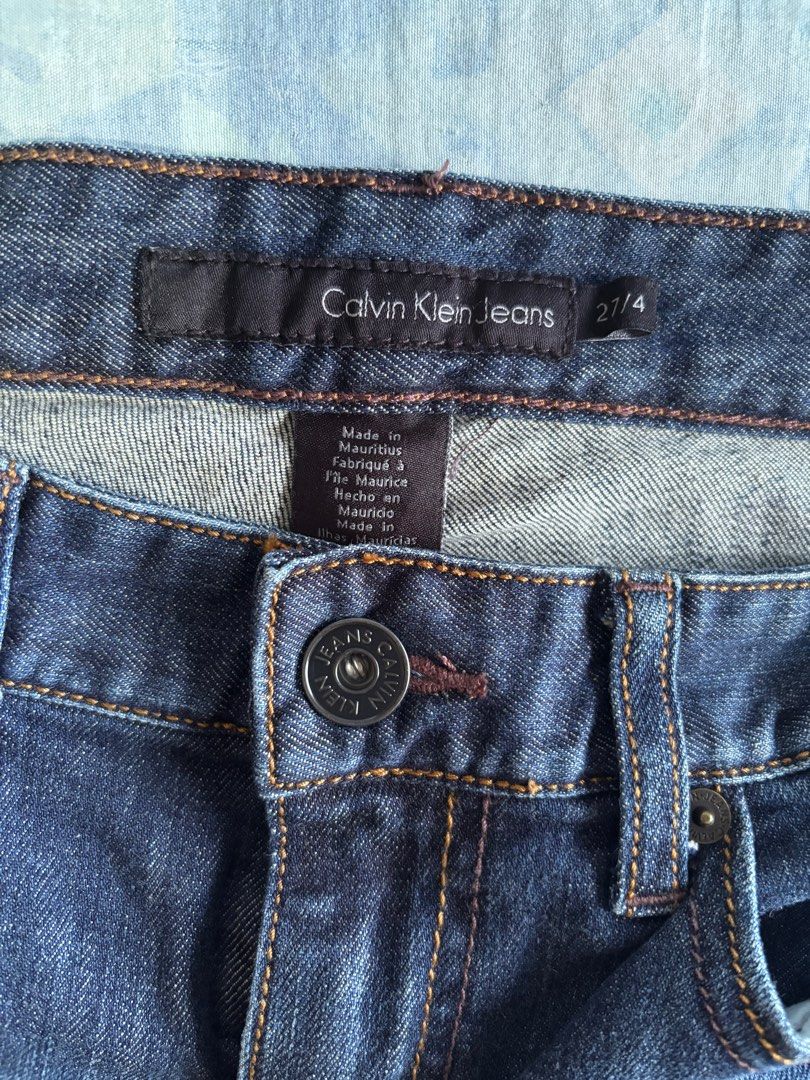 Calvin Klein Jeans (Category: Jeans) located in Orani. Submitted by cathsclothing (Listing ID 1402693110, Image 1). Description: - Dark wash Calvin Klein jeans - Made in Mauritius - Waist: 27 inches on tag but can fit to 29-31” - Length: 36.5” - Features Calvin Klein logo on back pockets - Button closure with Calvin Klein branding.