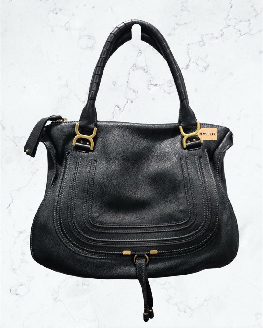 Chloe Marcie Leather Handbag (Category: Luxury Bags & Wallets) located in Quezon City. Submitted by shanpandora (Listing ID 1402828435, Image 1). Description: PRELOVED - Chloé Marcie Leather Tote Bag •Black calf leather grained texture •Embossed logo to the front twisted top handles foldover top internal zip-fastening pocket •Made in Italy •Lining: Linen/Flax 100% •Outer: Calf Leather 100% 💯 OG, Money back guarantee if proven fake! 🔔Disclaimer:
