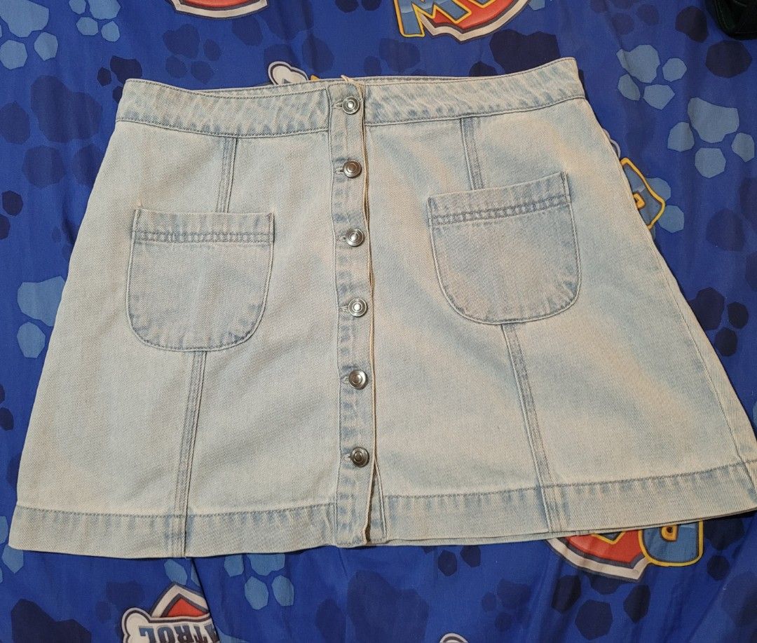 Forever 21 Denim Skirt (Category: Skirts) located in Dumaguete. Submitted by GreatFindsForLess_by_Krissy (Listing ID 1402693448, Image 1). Description: - Forever 21 denim skirt - Light wash - Size L - Button-down front.