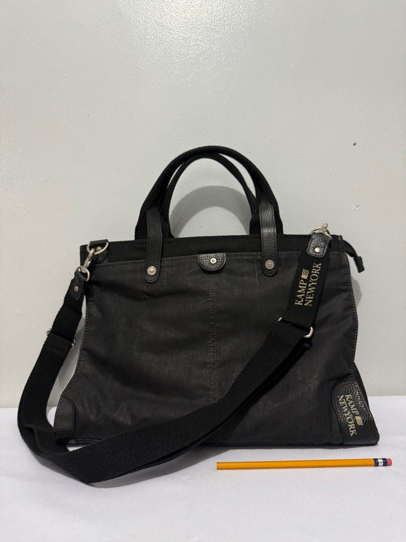Kamp New York Black messenger Bag (Category: Luxury Bags & Wallets) located in Davao. Submitted by rebaggedph (Listing ID 1402673433, Image 1). Description: Hey there! 👋 Check out this sleek Kamp New York black messenger bag! It's a versatile two-way bag, perfect for everyday use. It has both a top handle and a shoulder strap for different carrying options. The Kamp New York branding is subtly displayed, adding a touch of style. It's a great fin