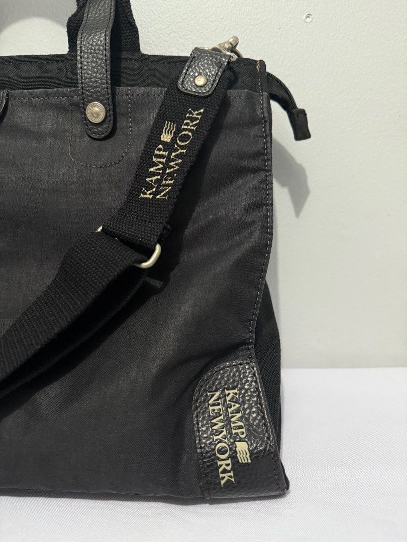 Kamp New York Black messenger Bag (Category: Luxury Bags & Wallets) located in Davao. Submitted by rebaggedph (Listing ID 1402673433, Image 2). Description: Hey there! 👋 Check out this sleek Kamp New York black messenger bag! It's a versatile two-way bag, perfect for everyday use. It has both a top handle and a shoulder strap for different carrying options. The Kamp New York branding is subtly displayed, adding a touch of style. It's a great fin