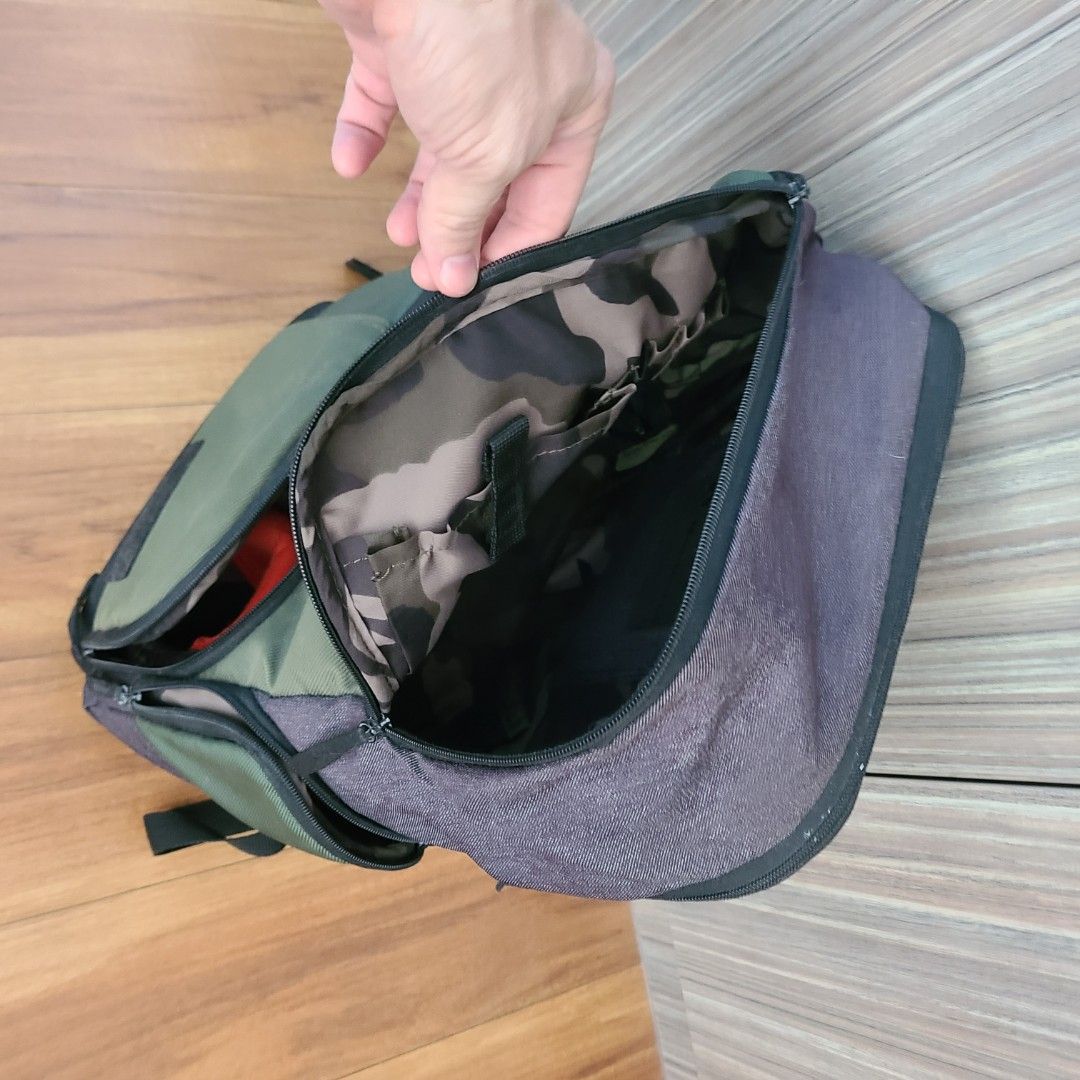 Manfrotto Camera back pack (Category: Laptop Bags & Sleeves) located in Singapore. Submitted by groovydad (Listing ID 1402744821, Image 2). Description: - Manfrotto camera backpack - Green, camoflouge and grey color scheme - Spacious interior - Multiple compartments for organization - Durable material.