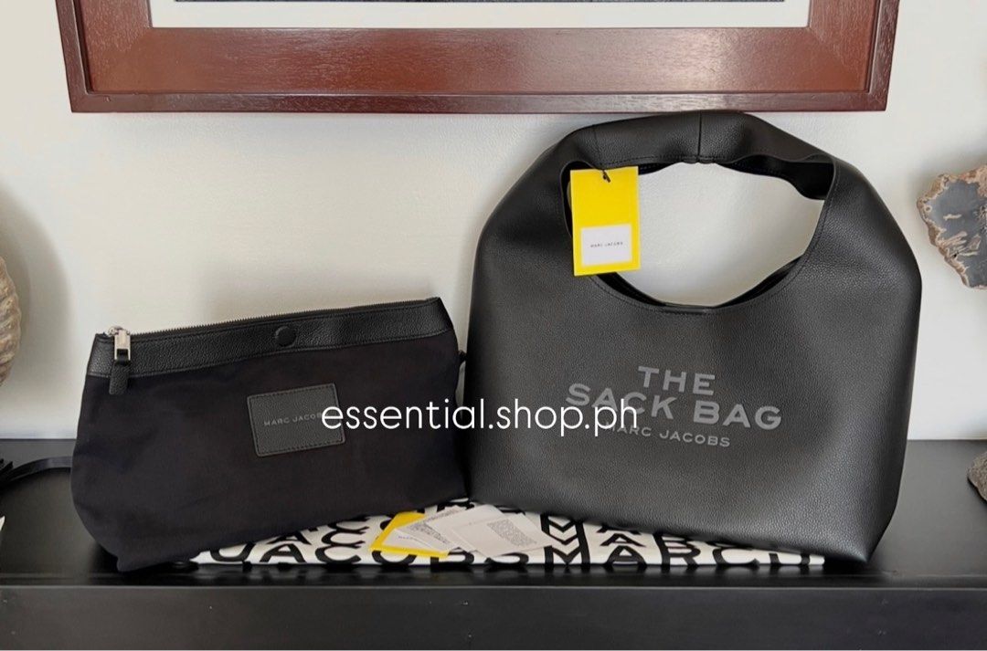 Marc Jacobs The Sack Bag Large (Category: Luxury Bags & Wallets) located in Manila. Submitted by essential.shop.ph (Listing ID 1402767809, Image 2). Description: FOR PRE-ORDER. 1-2weeks ETA. 4th photo for size comparison. Black Color. Includes matching pouch, dust bag, care card and paper bag Dimensions 15in L x 8in D x 9in H 38cm L x 21cm D x 23cm H Handle Drop 11in (28cm).