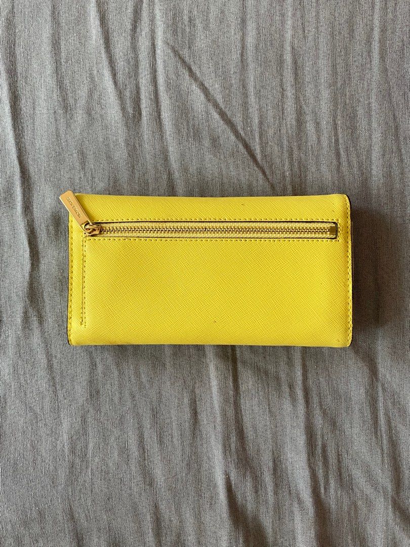 Michael Kors Wallet (Sunshine) (Category: Luxury Bags & Wallets) located in Pasay City. Submitted by itabiyou (Listing ID 1402700867, Image 2). Description: - Model: Michael Kors Jet Set Travel Large Trifold - Saffiano Leather + gold hardware - Used once - Authentic MK - Slightly negotiable - No dustbag/bag .