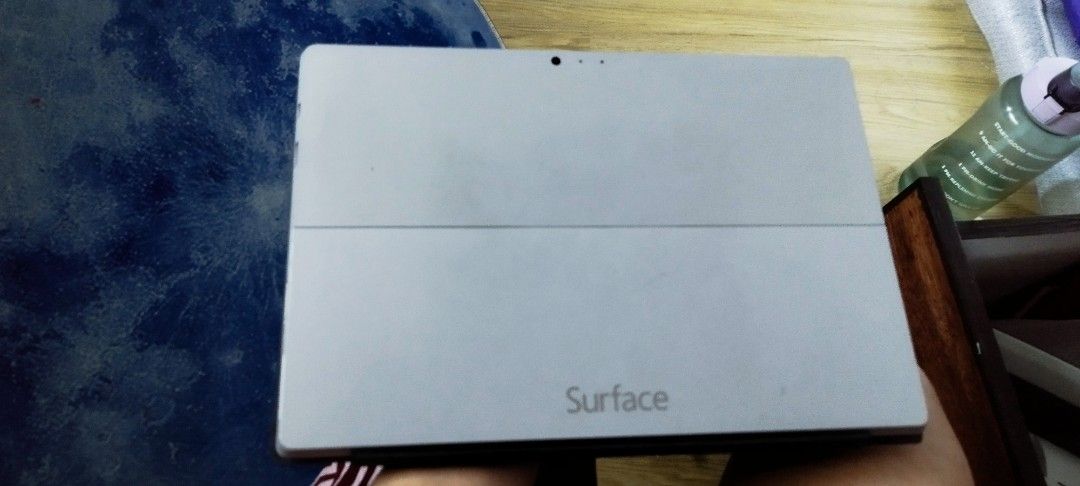 Microsoft Surface Tablet with Keyboard (Category: Laptops & Notebooks) located in Manila. Submitted by gelogwapogi (Listing ID 1402780867, Image 3). Description: - Silver Microsoft Surface tablet - Detachable keyboard with trackpad - Black screen when on - 'Surface' printed on the back.
