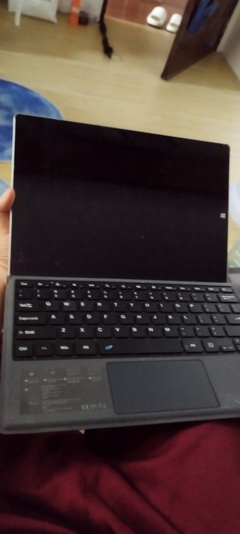 Microsoft Surface Tablet with Keyboard (Category: Laptops & Notebooks) located in Manila. Submitted by gelogwapogi (Listing ID 1402780867, Image 1). Description: - Silver Microsoft Surface tablet - Detachable keyboard with trackpad - Black screen when on - 'Surface' printed on the back.