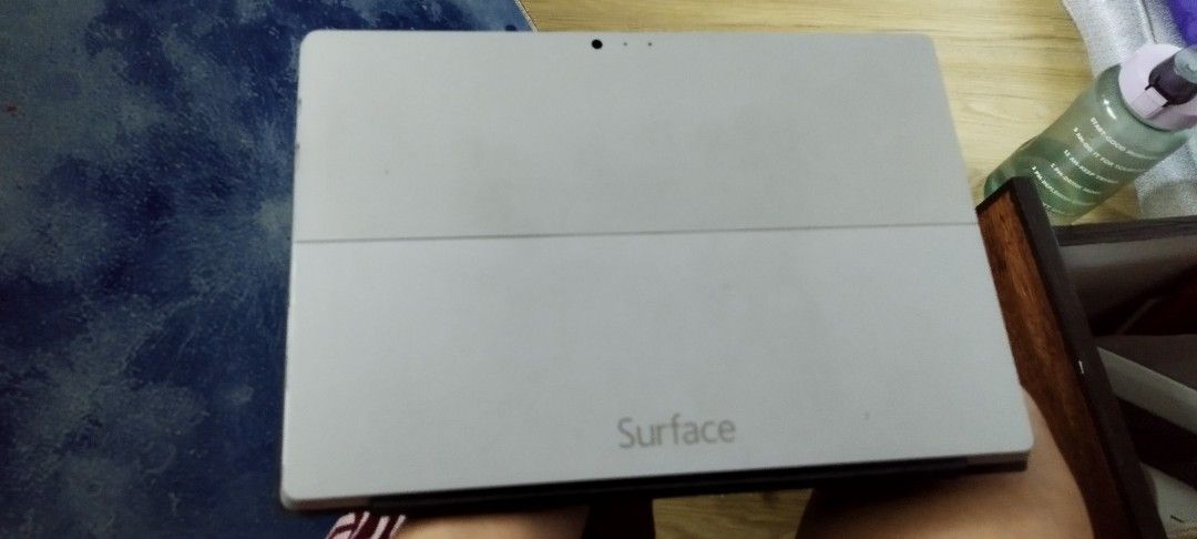 Microsoft Surface Tablet with Keyboard (Category: Laptops & Notebooks) located in Manila. Submitted by gelogwapogi (Listing ID 1402780867, Image 2). Description: - Silver Microsoft Surface tablet - Detachable keyboard with trackpad - Black screen when on - 'Surface' printed on the back.