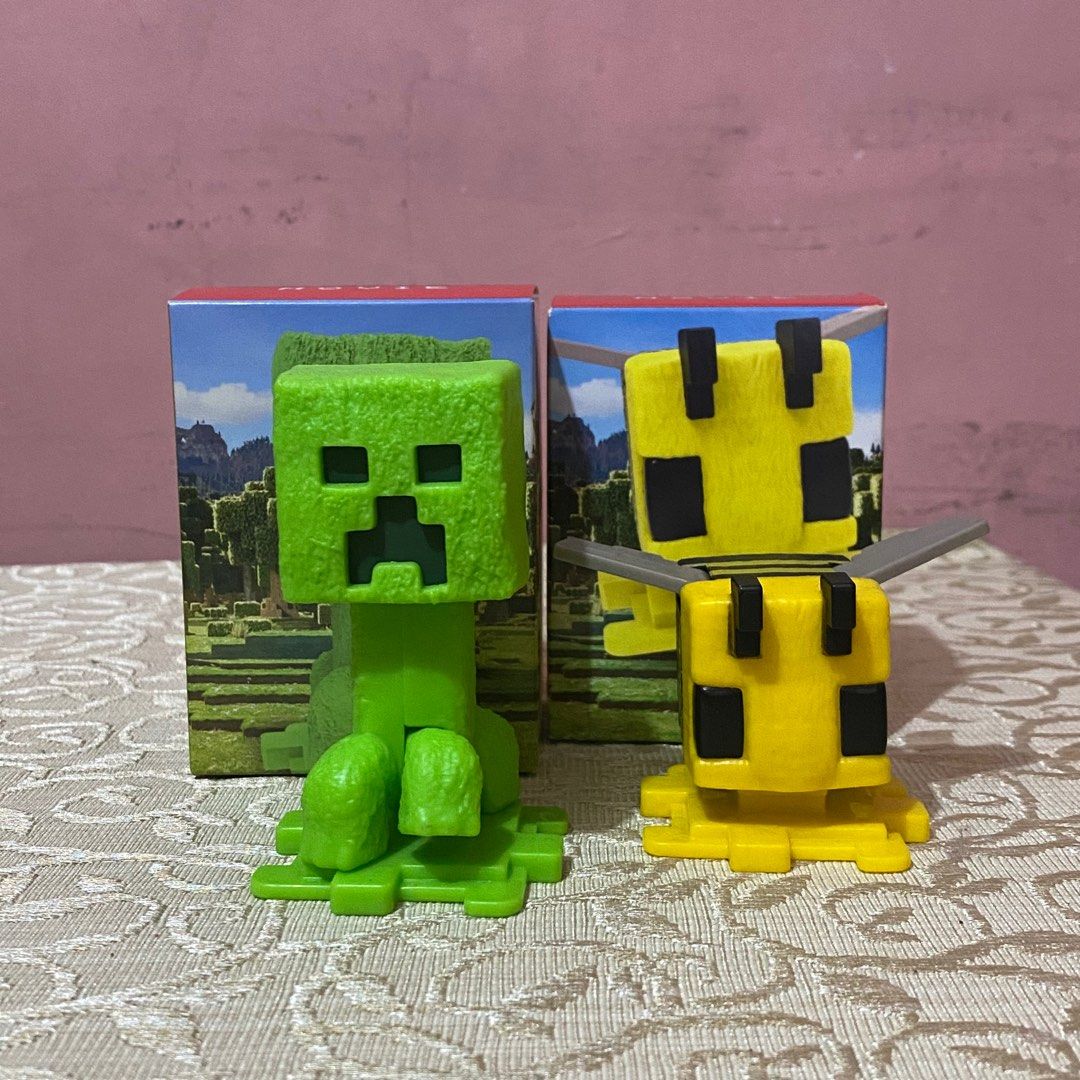 Minecraft Creeper and Bee Figurines (Category: Designer & Blind Box Toys) located in Manila. Submitted by user41579 (Listing ID 1402693112, Image 1). Description: mcdo happy meal minecraft toys with original box, sold as set! 🩷.