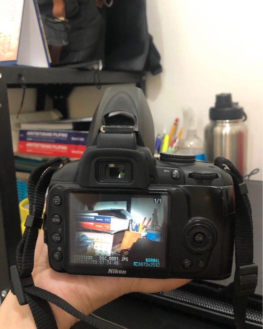 Nikon D3000 with 18–55mm lens (Category: Cameras) located in Manila. Submitted by dealornoodle (Listing ID 1402655994, Image 3). Description: NIKON D3000 with 18–55mm lens Shutter Count: 32,339 includes: - AF-S DX NIKKOR 18-55mm lens for Nikon condition: - shows signs of use - charger untested - vignette on camera screen, but does not affect photo quality or performance (see last photo).