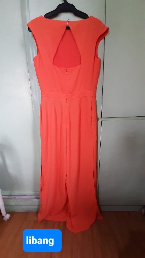 Nordic Winds Orange Jumpsuit with slits (Category: Jumpsuits) located in Paranaque City. Submitted by jiggsly (Listing ID 1402675851, Image 2). Description: - Nordic Winds orange jumpsuit - Size: L - Features: - Sleeveless design - Keyhole back - Side slits - Round neckline - Back zipper closure.