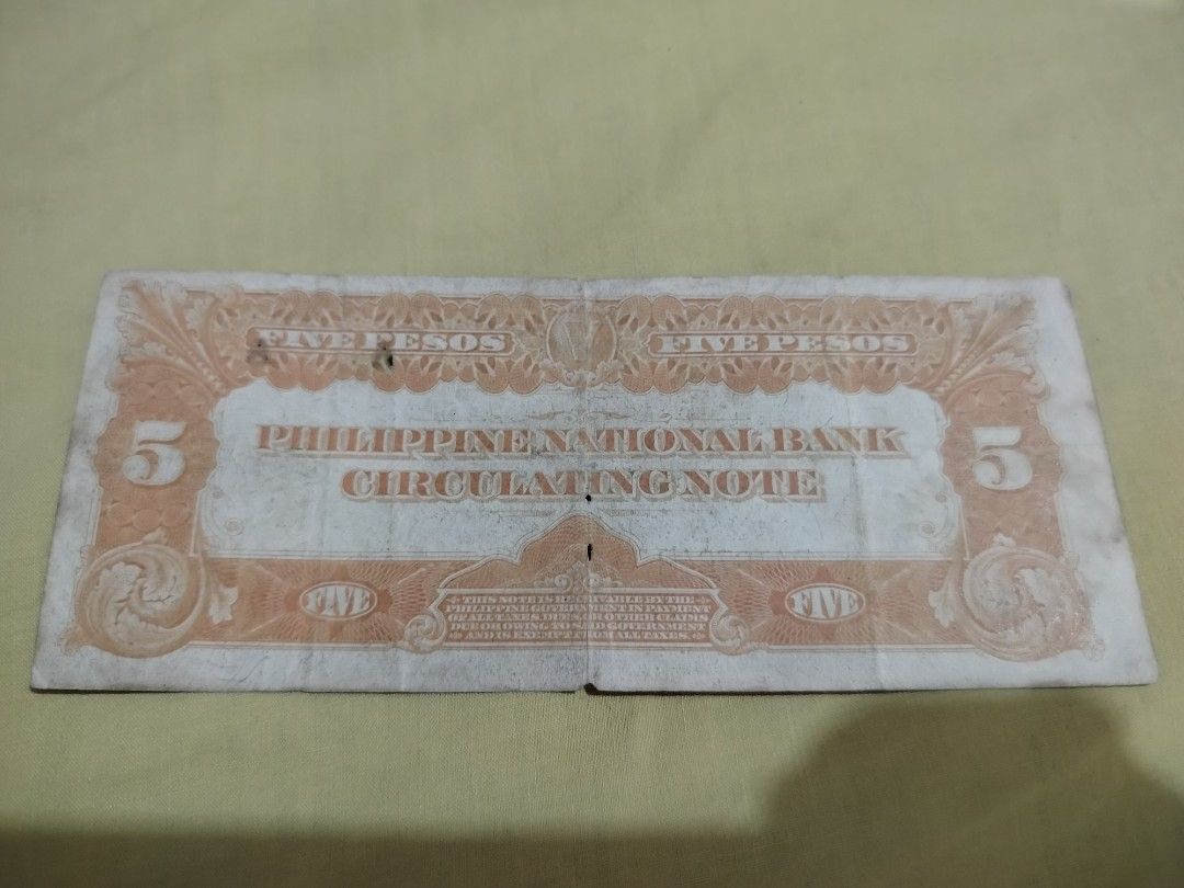 Philippine National Bank 5 Pesos Circulating Note (Category: Currency) located in Malabon City. Submitted by userofgames1233 (Listing ID 1402798789, Image 2). Description: Philippine National Bank 5 Pesos circulating note. Features a portrait of a man on the front and the denomination on both sides. The note is dated and includes the serial number B416764B. The back of the note displays the denomination and the bank's name..