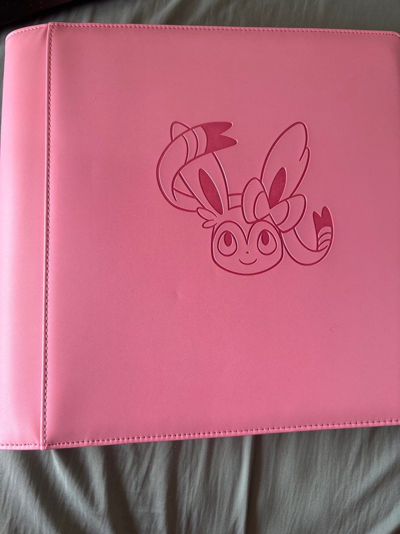 Sylveon binder + Pokemon cards, Hobbies & Toys, Toys & Games on Carousell