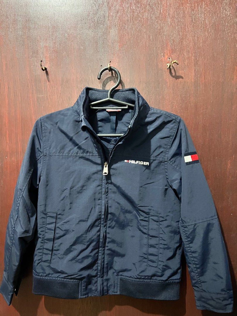 Tommy Hilfiger Navy Jacket (Category: Babies & Kids Fashion) located in Manila. Submitted by _baglover21 (Listing ID 1402828763, Image 2). Description: - Tommy Hilfiger navy jacket used twice - Size: S/P (6-7) - Full zip closure - With packable hoody -10/10 condition.