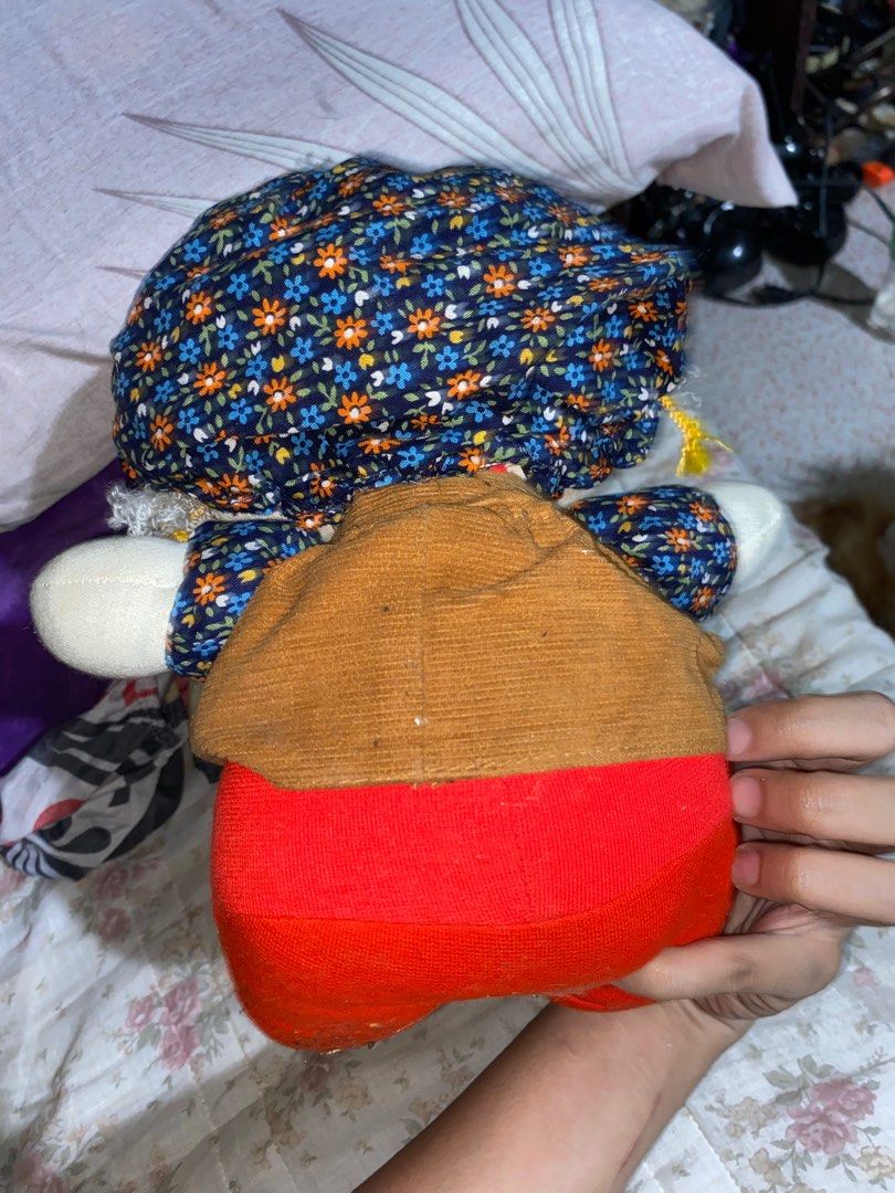 Vintage rag Doll (Category: Plushies & Soft Toys) located in Manila. Submitted by vleinn_cantreplytoyall (Listing ID 1402788914, Image 2). Description: - Vintage doll - Soft fabric body - Curly white hair - Brown top with white buttons - Blue floral collar - Red pants - Black eyes and red nose - Collectible item.