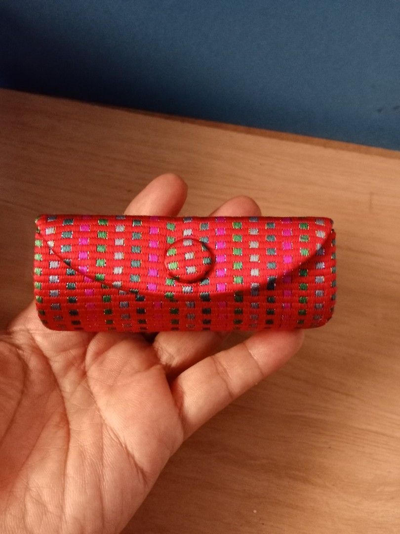 Vintage Red Lipstick Case with Mirror (Category: Makeup) located in Bocaue. Submitted by marajapansurplus (Listing ID 1402682345, Image 1). Description: Vintage lipstick case features a vibrant red woven fabric exterior. It has a button closure and opens to reveal a small mirror. The case is compact and designed to hold a lipstick. It's a stylish accessory for carrying your favorite lipstick..