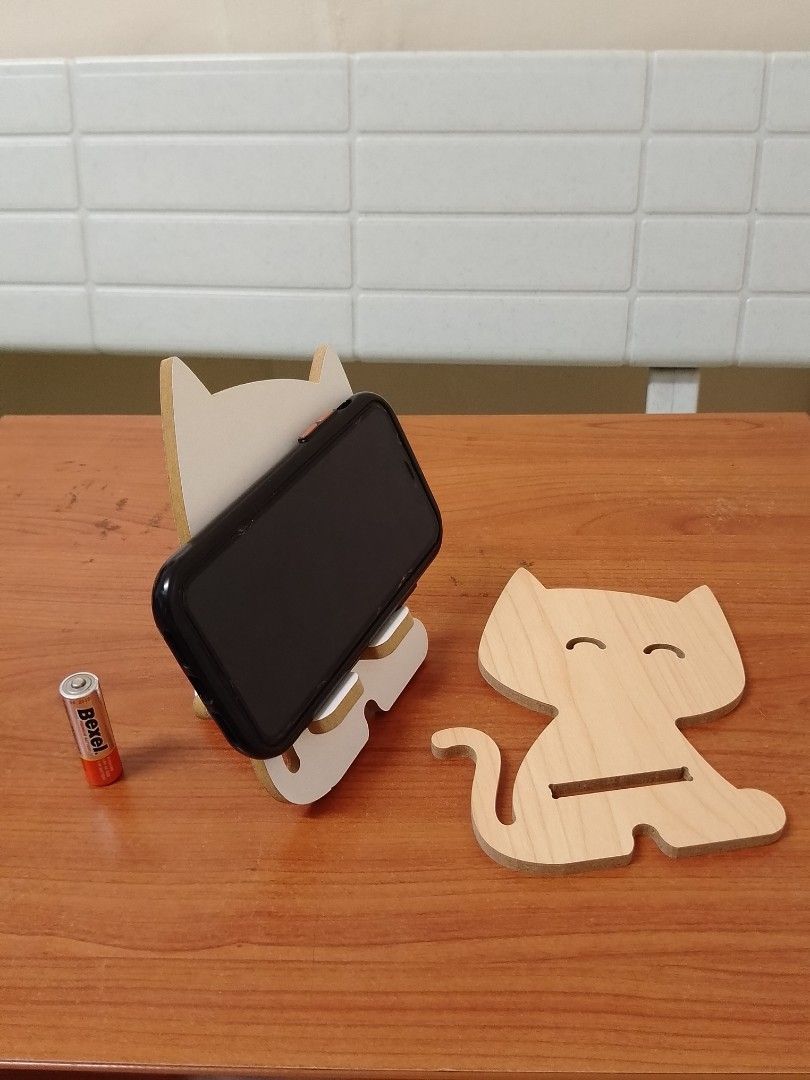 Wooden Cat design cellphone stand (Category: Mounts & Holders) located in Quezon City. Submitted by bees.kitty (Listing ID 1402834665, Image 2). Description: Wooden Cat design cellphone stand P50 - never used - sold as is - no reservation ‎- no pm, no transaction ‎- first to confirm and pay gets the item.