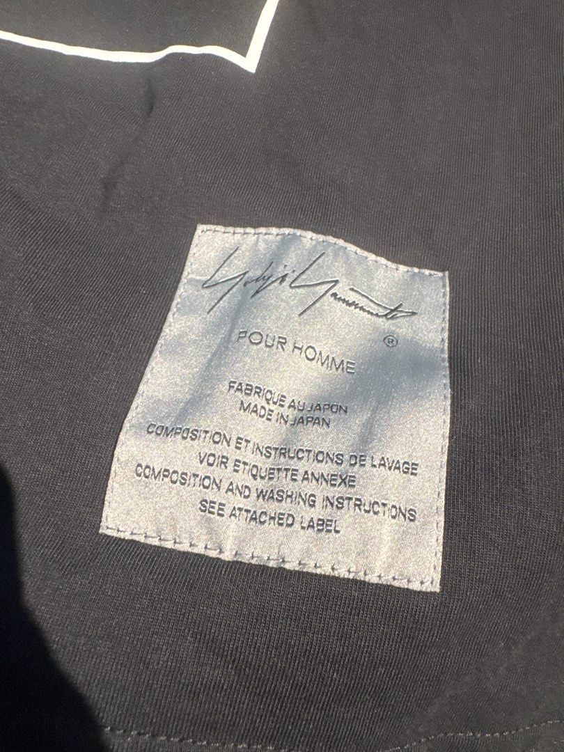 Yohji Yamamoto POUR HOMME x Neighborhood T-shirt (Category: Tshirts & Polo Shirts) located in Singapore. Submitted by goshhhhhhhh (Listing ID 1402728123, Image 3). Description: - Brand new Yohji Yamamoto POUR HOMME T-shirt - From the 2024 Spring Summer Collection - Collaboration with Neighborhood - Made in Japan - Comes with original tags and packaging.
