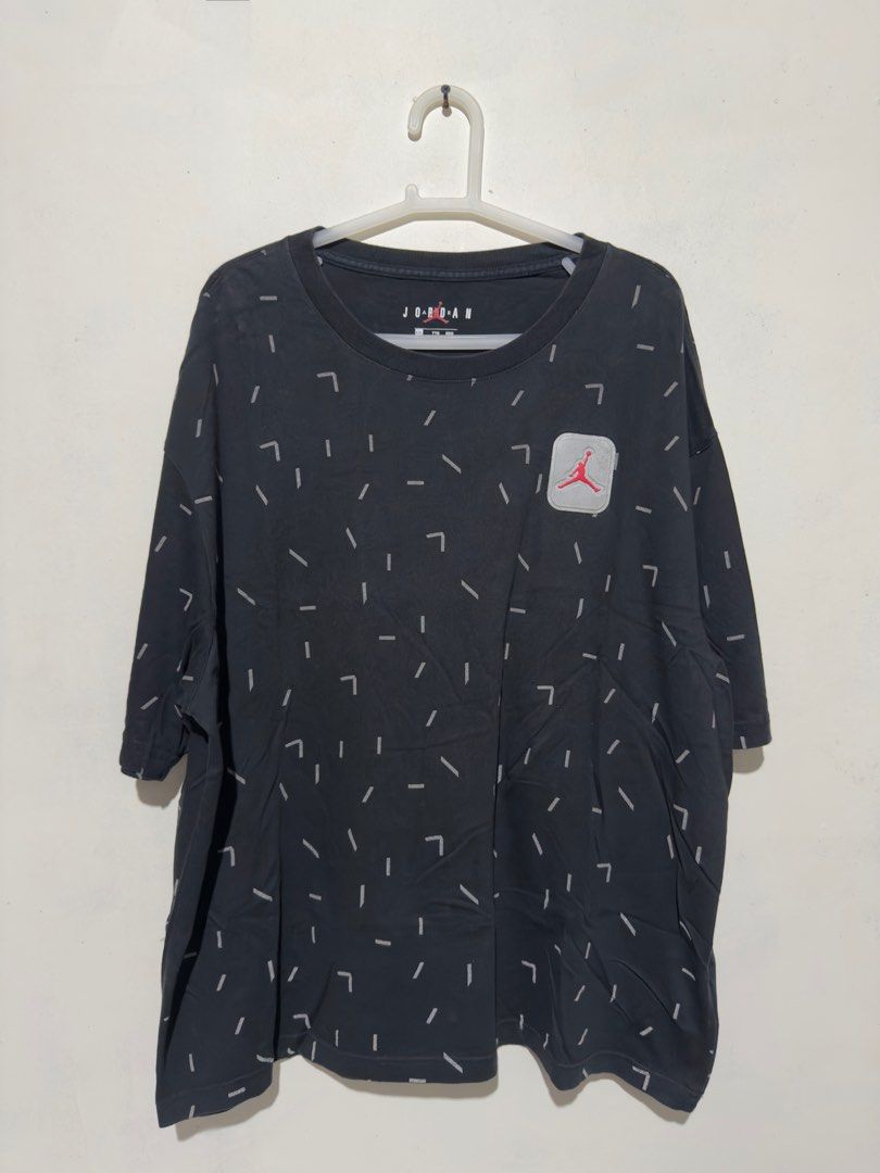 Air Jordan (Reflective Jumpman Logo) (Category: Tshirts & Polo Shirts ) located in Bulacan. Submitted by streethrifter (Listing ID 1402850458, Image 1). Description: Jordan Legacy AJ5 AOP Short Sleeve T-Shirt (Black, Reflective Print) 📏 Size: Width — 22 inches Length — 27 inches 🧸 Condition: 8/10 — Patina black looks even and clean. No scratches, pinholes, or stains. Minor issue: small spots on the reflective logo (see photo for detail). 🎨 Col