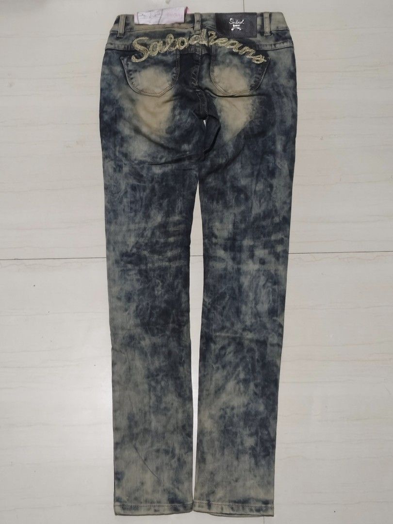 (AUTHENTIC) SALAD Y2K JEANS (Category: Jeans) located in Orion. Submitted by irish___ (Listing ID 1402950616, Image 2). Description: WAIST: 26 LENGTH: 39 LOW WAIST✅ BRANDNEW WITH TAGS✅ 100+SF - Authentic Salad Y2K Jeans - Features a unique wash and design - Excellent condition - Perfect for Y2K style enthusiasts - High-quality brand 3 PCS AVAILABLE🙀.