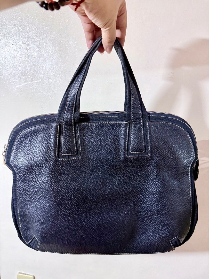 Bally Laptop Handbag (Category: Luxury Bags & Wallets) located in Cavite. Submitted by lady_speculator_ph (Listing ID 1402972947, Image 1). Description: ✅ Elegant Bally handbag crafted from textured leather. ✅ Features a zip closure, dual top handles, and a spacious interior with a zip pocket. ✅ The bag showcases a classic design with contrasting stitching details. ✅ The interior includes a Bally brand tag. Made in Italy. ✅ No damage interior and