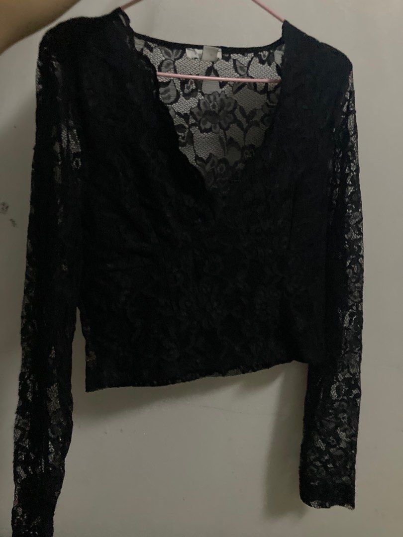 Black Lace long sleeve Top (Category: Sleeveless) located in Cainta. Submitted by declutterdevil (Listing ID 1402951997, Image 1). Description: - Black lace top - Long sleeves - V-neck design - Cropped length - Delicate lace fabric - Stylish and sophisticated look - Perfect for layering.