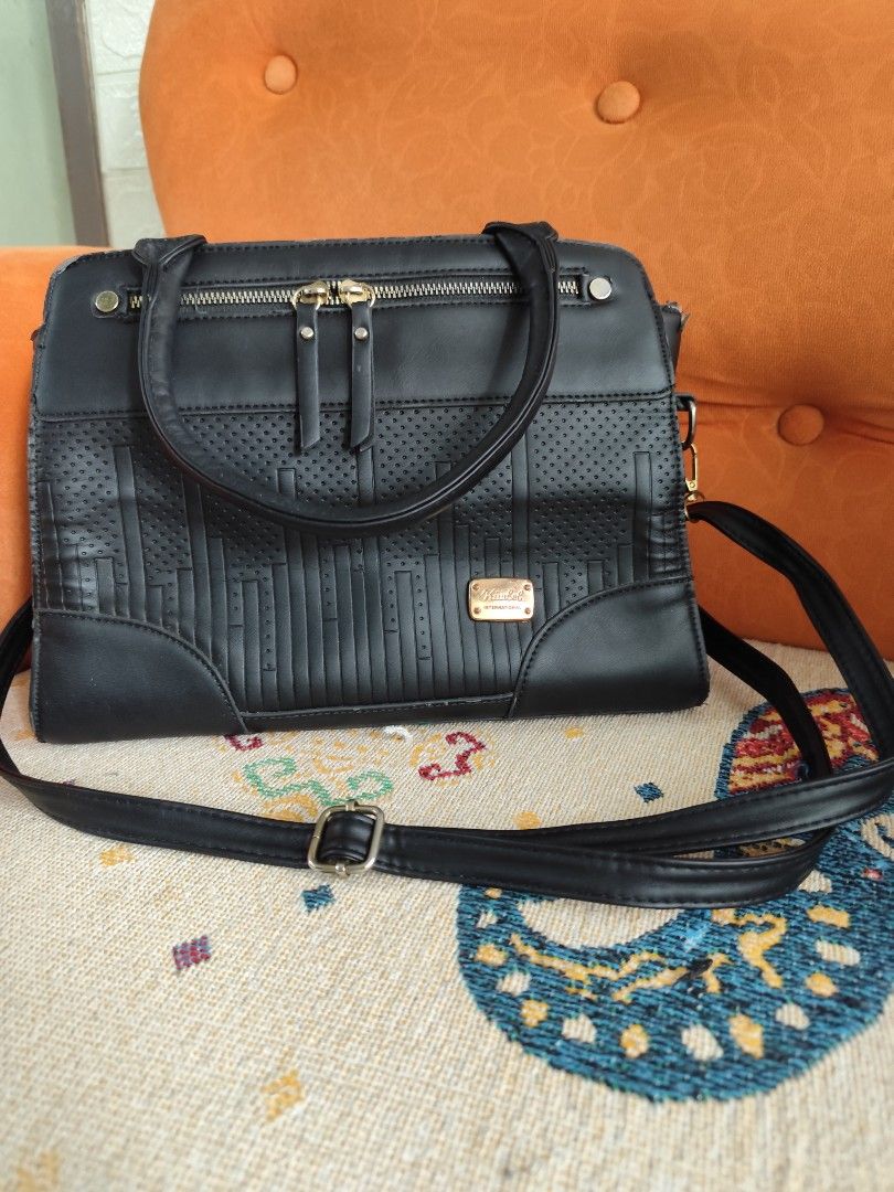Black Shoulder Bag with Gold Accents (Category: Shoulder Bags) located in Cavite. Submitted by aries818 (Listing ID 1402848755, Image 1). Description: - Black shoulder bag - Textured front panel - Top handle and detachable strap - Gold-toned metal accents - Adjustable strap - zipper closure.