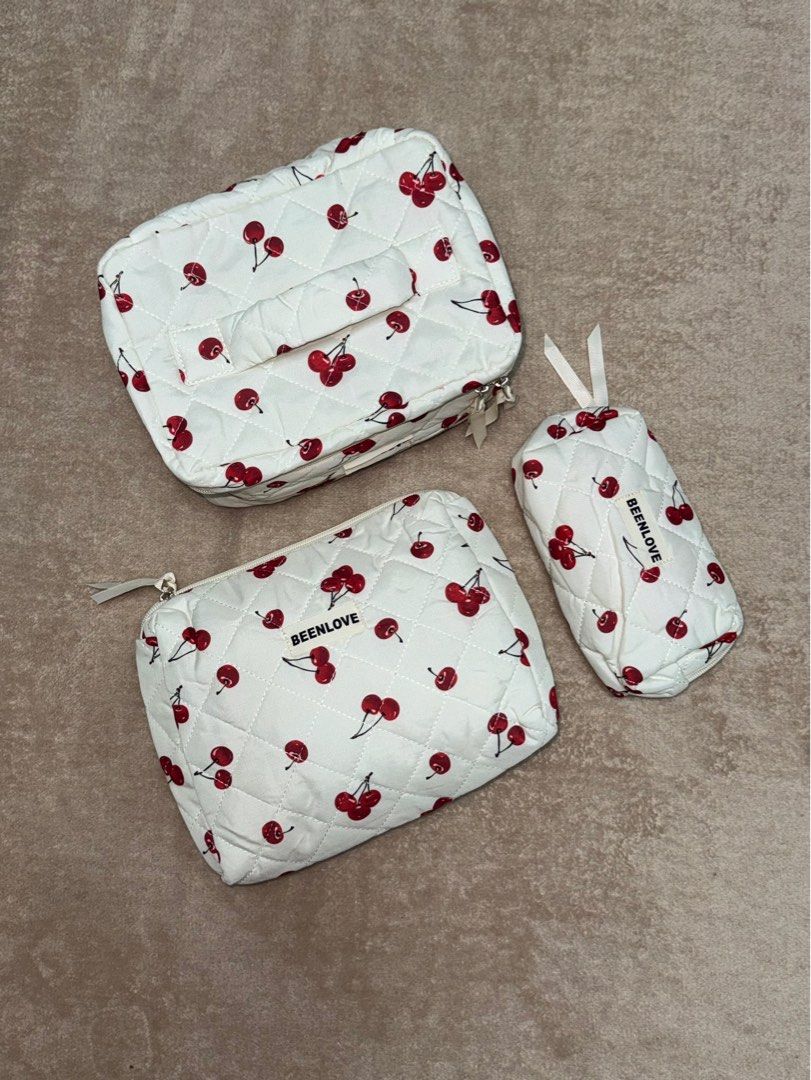 Brandnew 3in1 Cosmetic Bag Set (Category: Makeup) located in Manila. Submitted by _chingchingcart (Listing ID 1402996185, Image 3). Description: 3pcs in 1 Set: - 1 vanity bag - 1 medium pouch - 1 small pouch 5in1 pink ribbon set - 200 each 3in1 cherry set - 185 each 3in1 pink ribbon and flower set - 170 each - brandnew - sealed.