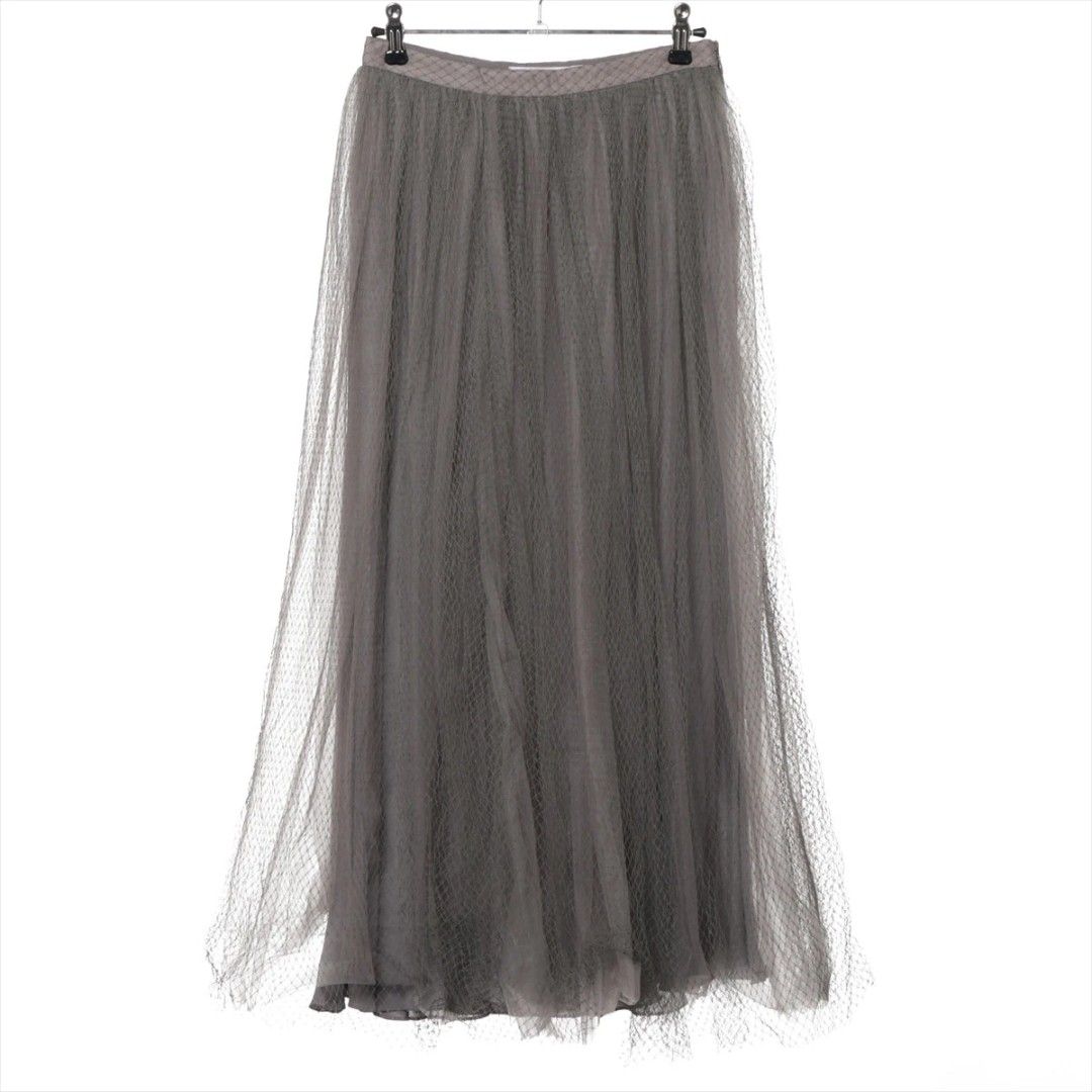 Christian Dior Tulle Skirt (Category: Luxury Apparel) located in San Jose. Submitted by cheapest_thrill_closet (Listing ID 1402983167, Image 1). Description: Christian Dior Tulle Skirt Brand & Origin: Christian Dior Paris, Made in Italy. Color & Fabric: The skirt is a sophisticated dusty olive green or khaki-grey color. It is made of multiple layers of fine tulle/netting (100% Polyamide) with a layer of silk lining ("Doublure - Lining: 100% Soie 
