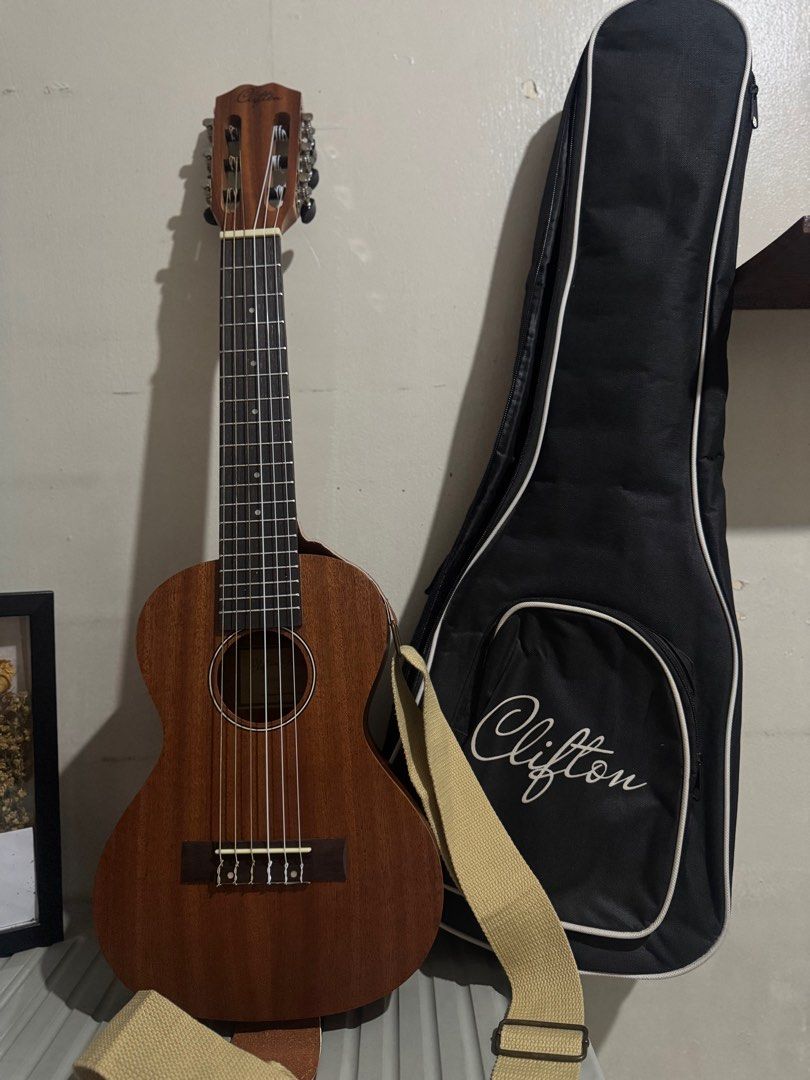 Clifton Guitalele (Category: Musical Instruments) located in Manila. Submitted by shdavid (Listing ID 1402943758, Image 2). Description: With original strap and bag Hindi po nagamit ng pamangkin 😊 .