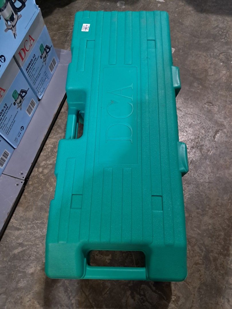 DCA Demolition Hammer (Category: Construction Tools & Equipment) located in Makati City. Submitted by mandiajan62104 (Listing ID 1402857818, Image 2). Description: - DCA demolition hammer - Original green case - Color: Green and black - Includes accessories - Black power cord - Black and gray handle.
