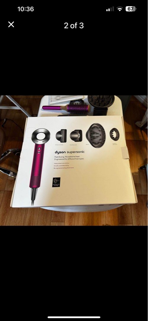 Dyson Supersonic Hair Dryer (Category: Hair) located in Quezon City. Submitted by the_happy_mess_shop (Listing ID 1402971885, Image 2). Description: - Dyson Supersonic hair dryer - Vibrant magenta color - Includes round brush, comb, diffuser, and styling attachments - Designed for fast drying and heat protection - Comes with original box, user manual and accessories.