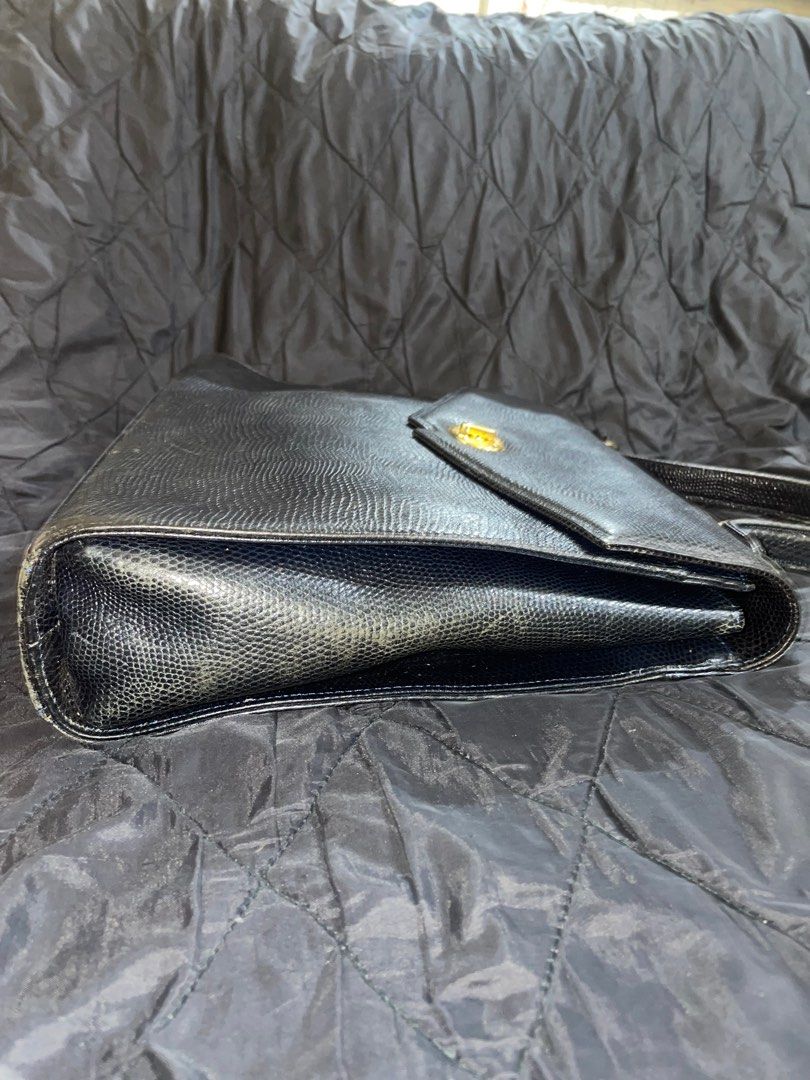 Emilio Ungaro Laptop bag (Category: Luxury Bags & Wallets) located in Cavite. Submitted by msandysgoodies (Listing ID 1402921181, Image 3). Description: Emilio Ungaro laptop bag Top handle Minor signs of use on edges .