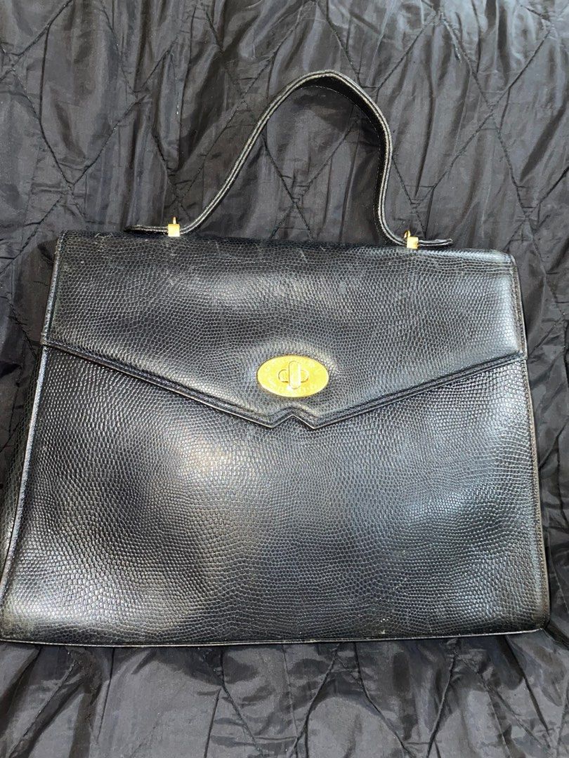 Emilio Ungaro Laptop bag (Category: Luxury Bags & Wallets) located in Cavite. Submitted by msandysgoodies (Listing ID 1402921181, Image 1). Description: Emilio Ungaro laptop bag Top handle Minor signs of use on edges .