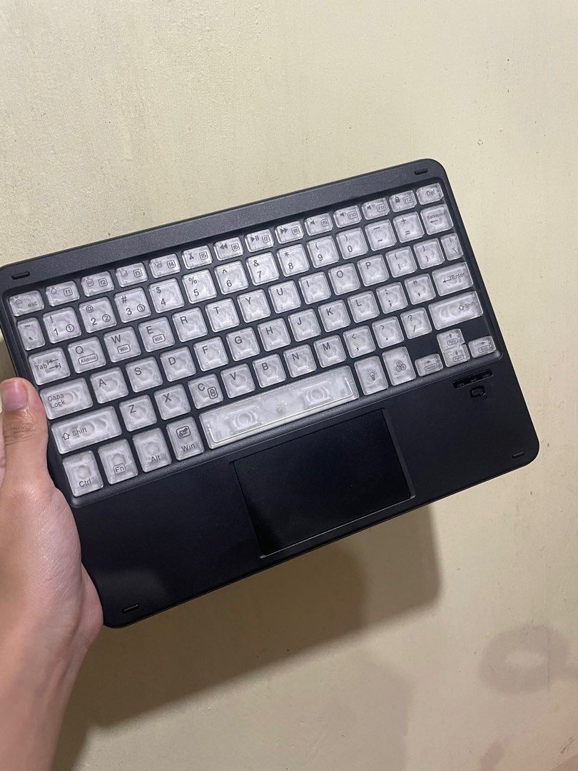 Goojodoq Wireless Keyboard with Touchpad and LED (Category: Computer Keyboard) located in Bulacan. Submitted by elibulacan (Listing ID 1403017766, Image 2). Description: - Wireless keyboard with built-in touchpad - LED backlighting with multiple color options - Sleek black design - Full set of keys - Designed for tablets and similar devices - Clear keycap design Payment first / COD.