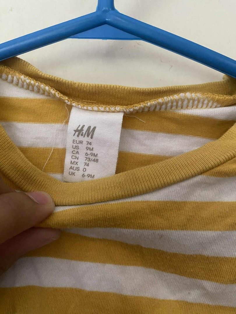 H&M Striped Long Sleeve Shirt (Category: Babies & Kids Fashion) located in Angeles City. Submitted by randomgoodies_ (Listing ID 1402877294, Image 2). Description: - H&M long sleeve shirt - Yellow and white stripes - Round neckline - Size: 9M (fits 6-9 months) - Soft material - Easy to pair.