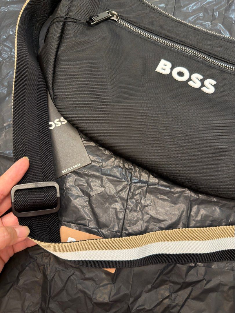 HUGO BOSS Sling bag with tag (Category: Sling Bags) located in Paranaque City. Submitted by lpt02 (Listing ID 1403023459, Image 2). Description: HUGO BOSS Sling bag with tag as seen on photos 🎄 Perfect Christmas gift to loved ones Original Price: ₱14,500 RFS: husband already has too many sling bags. Way too many na talaga. IMPORTANT READ: - BUYER may book his/her own rider (personally, I prefer Grab for reliability and security natin dalawa) - I