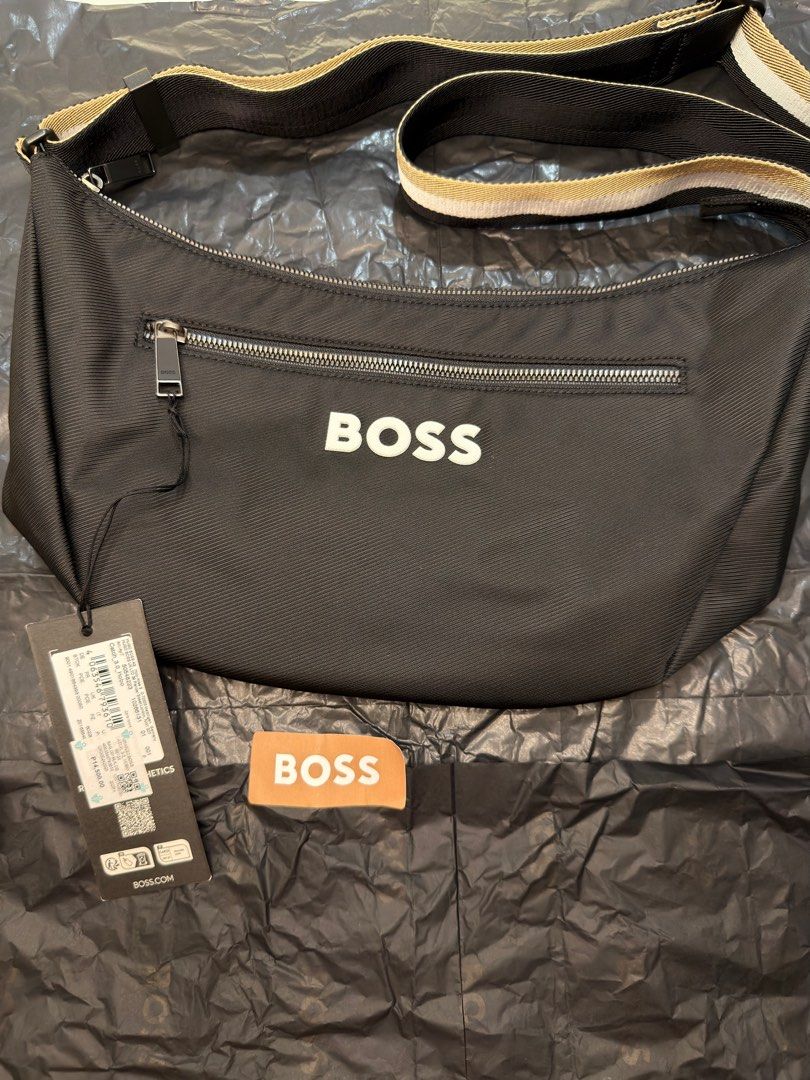 HUGO BOSS Sling bag with tag (Category: Sling Bags) located in Paranaque City. Submitted by lpt02 (Listing ID 1403023459, Image 1). Description: HUGO BOSS Sling bag with tag as seen on photos 🎄 Perfect Christmas gift to loved ones Original Price: ₱14,500 RFS: husband already has too many sling bags. Way too many na talaga. IMPORTANT READ: - BUYER may book his/her own rider (personally, I prefer Grab for reliability and security natin dalawa) - I