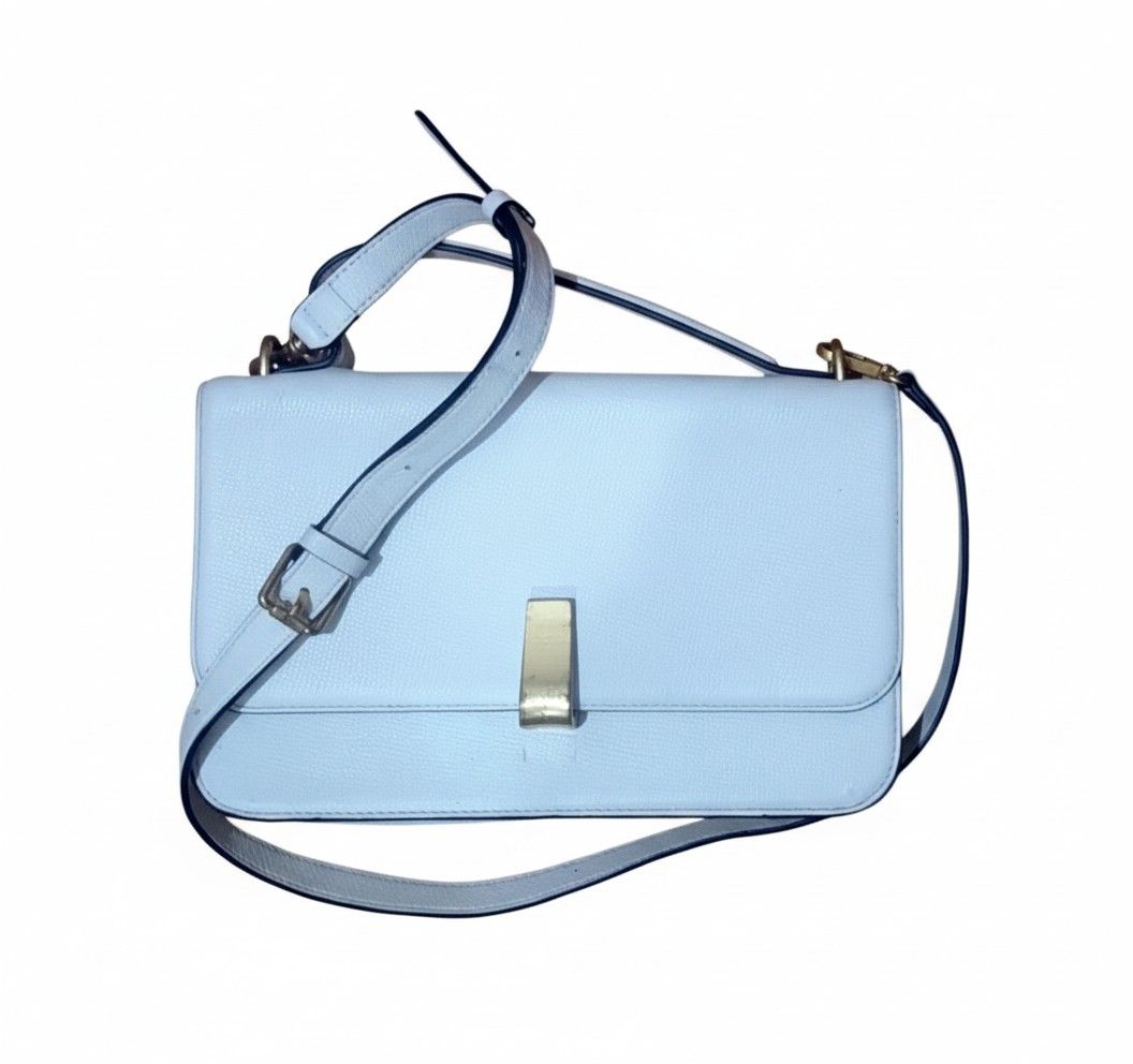 Joy Gryson Margot Satchel White Bag (Category: Purses & Pouches) located in Quezon City. Submitted by jay0708 (Listing ID 1402947590, Image 1). Description: Joy Gryson Shoulder Bag – Style LWOS-B3372 (White) Authentic Joy Gryson shoulder bag crafted from premium textured white leather. Features a gold-tone clasp, adjustable strap, and structured silhouette for a timeless, elegant look. Comes with original tag, guarantee card, and care booklet sho