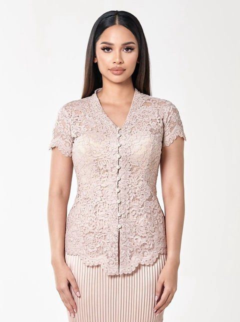 Kebaya Wirda (Category: Traditional & Ethnic wear) located in Singapore. Submitted by riverax (Listing ID 1402969459, Image 2). Description: Elaila Kebaya - Champagne colour - elegant short sleeve kebaya with intricate lace detailing and a flattering bodycon fit. - V-neckline kebaya feature pearl buttons details. -Complete the look with the rok pleated skirt. -100% premium cotton lace, non-stretchy -Hand beaded embellishment -Dry clean or hand-wa