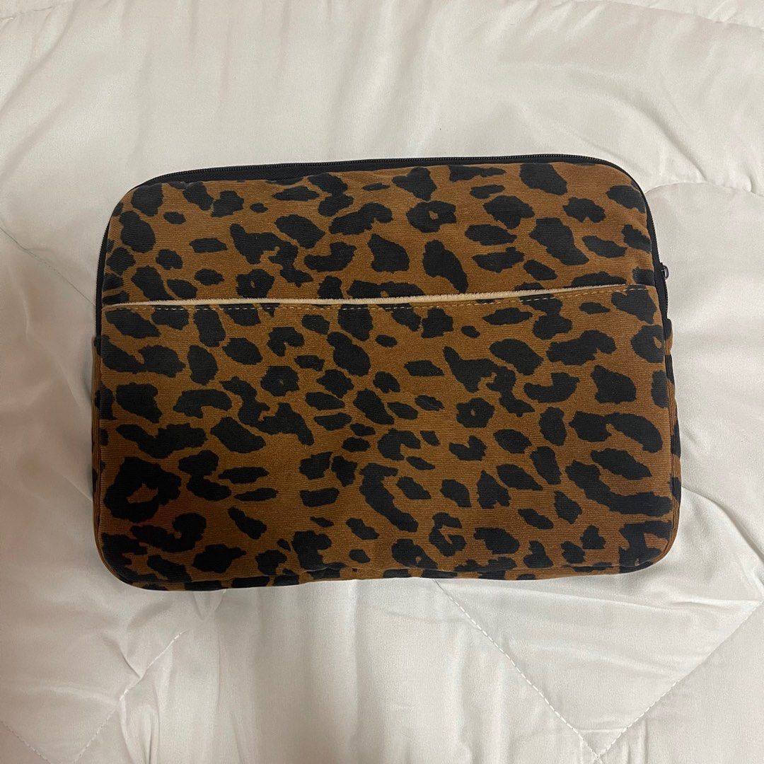 Leopard Print Laptop Sleeve (Category: Laptop Bags & Sleeves) located in Vigan. Submitted by rgdeclutters (Listing ID 1402973890, Image 1). Description: Free with any item you buy from my listings. Fits up to 15 inch laptop. Zipper is broken as seen on last photo..