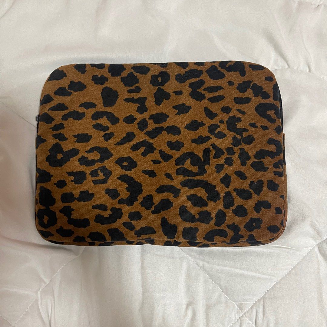 Leopard Print Laptop Sleeve (Category: Laptop Bags & Sleeves) located in Vigan. Submitted by rgdeclutters (Listing ID 1402973890, Image 2). Description: Free with any item you buy from my listings. Fits up to 15 inch laptop. Zipper is broken as seen on last photo..